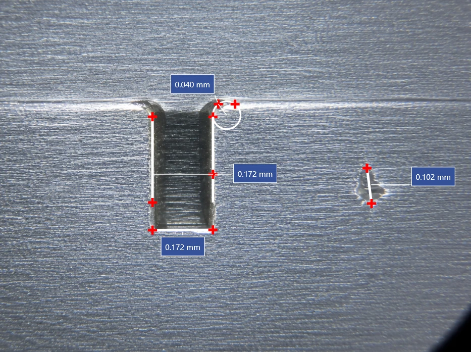 Line and parallel measurements labelled in millimetres across a machined slot